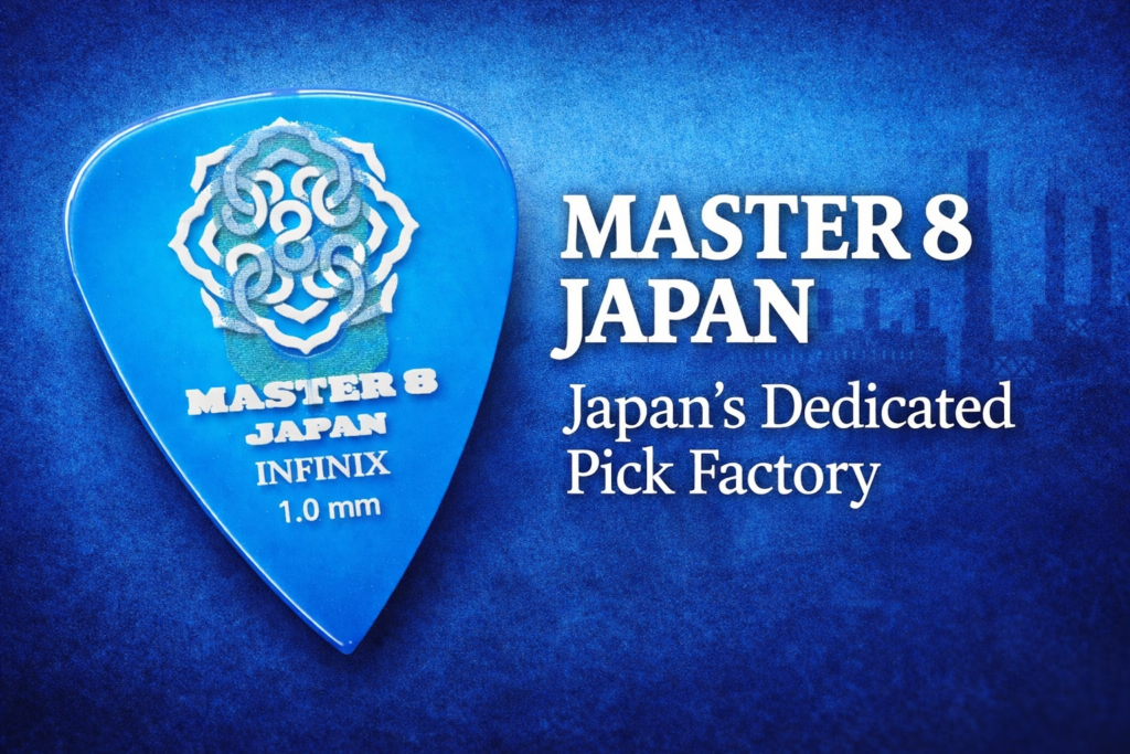 Blue Master 8 Japan INFINIX 1.0mm guitar pick with the text “Master 8 Japan – Japan’s Dedicated Pick Factory.”