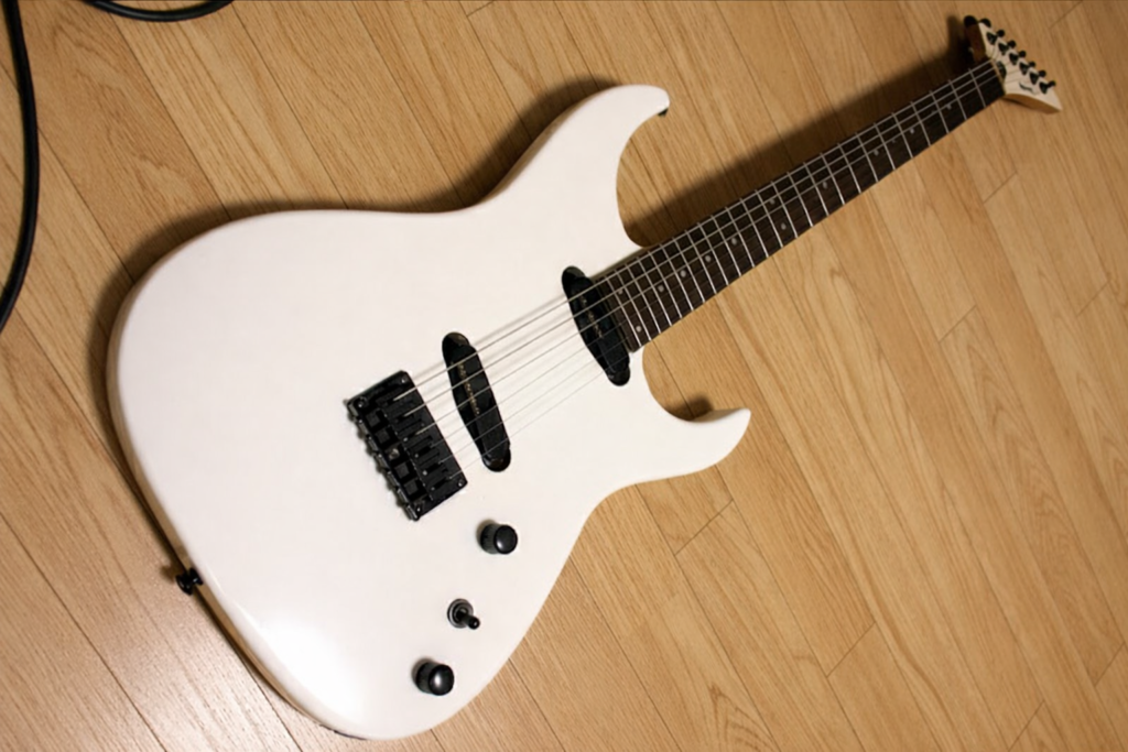Fernandes FJT-80 My first guitar, a white Fernandes FJT-80 headless electric guitar, on a wooden floor