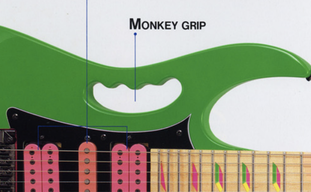 Ibanez JEM monkey grip handle cutout design on green JEM body