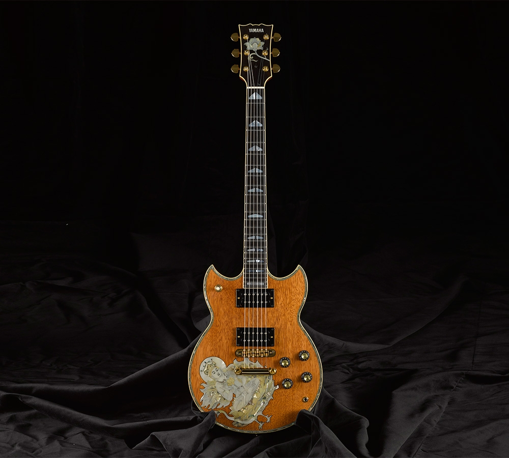 Yamaha SG175 Buddha custom electric guitar with carved artwork developed from Santana’s feedback