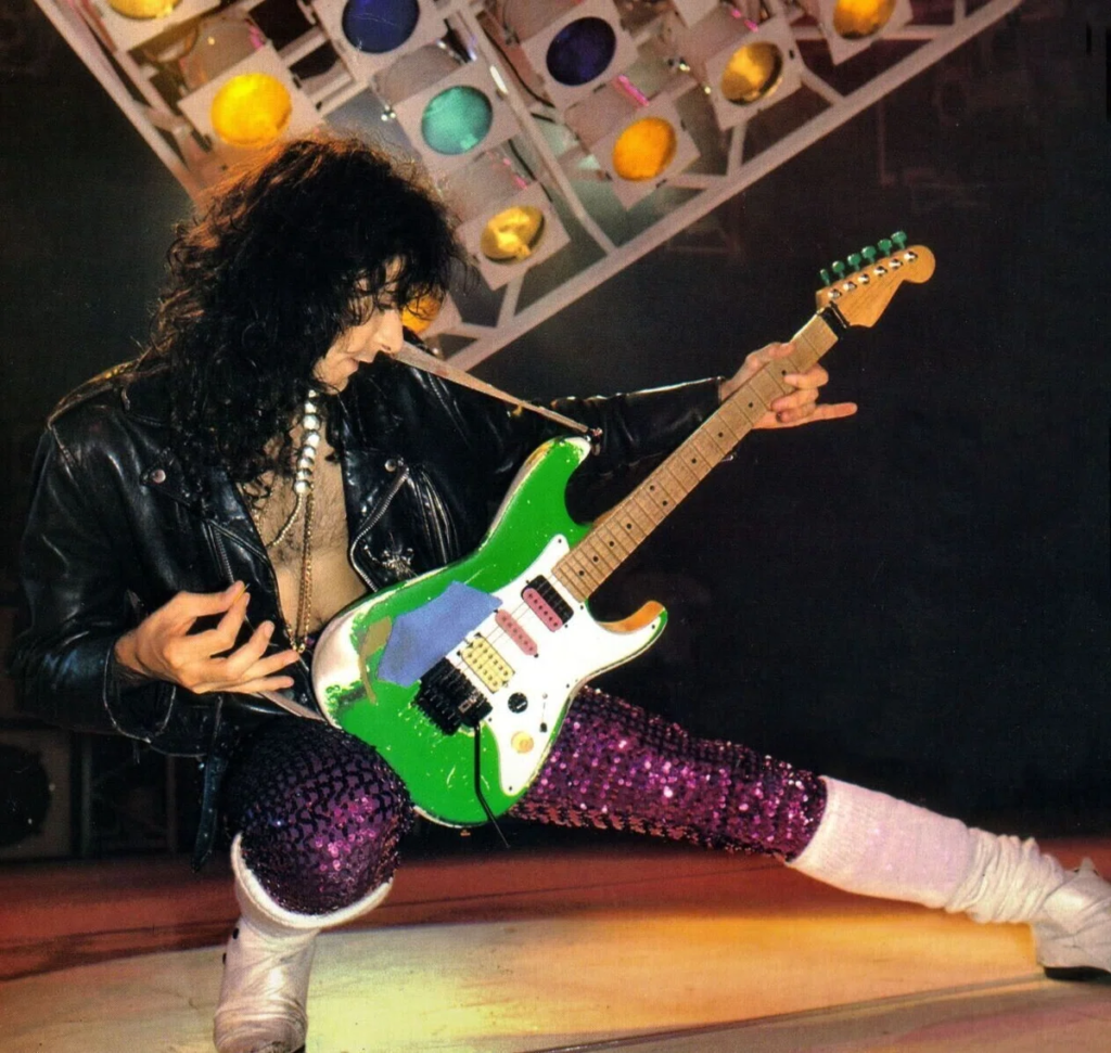 Steve Vai performing with the Green Meanie guitar during the development era that led to the RG series