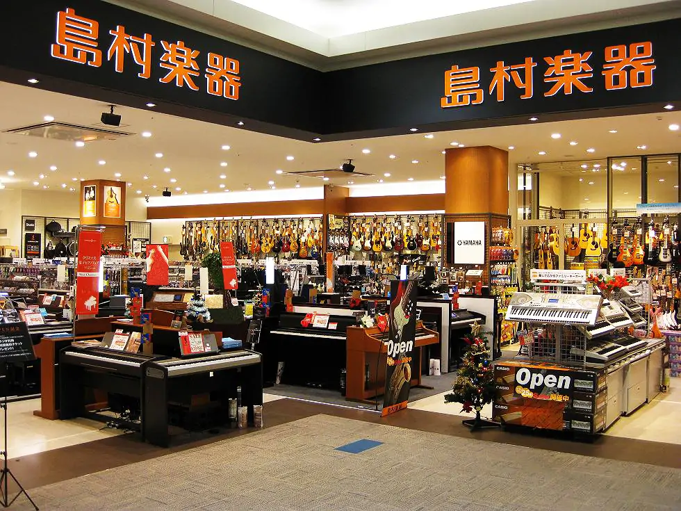 Interior of a Shimamura Music store with guitars, keyboards, and musical instruments
