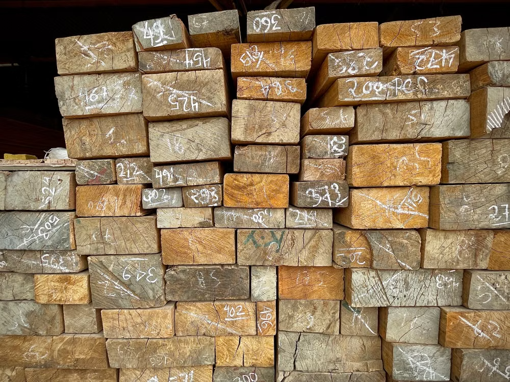 Stacks of seasoned lumber used for guitar production
